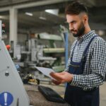 worker operating machine in factory